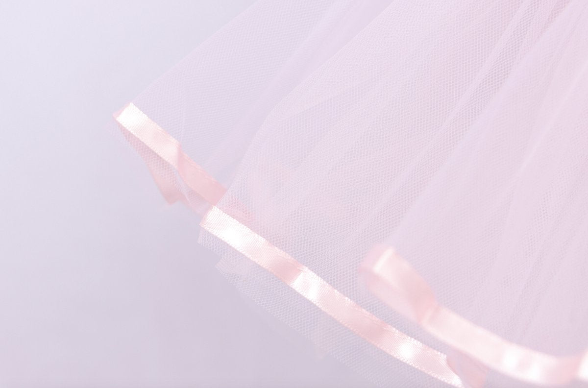 Roze balletpakje met tutu en glitterprint
